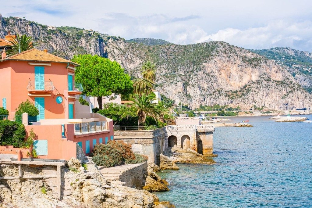 A waterfront house and the cliffs at Beaulieu-sur-Mer