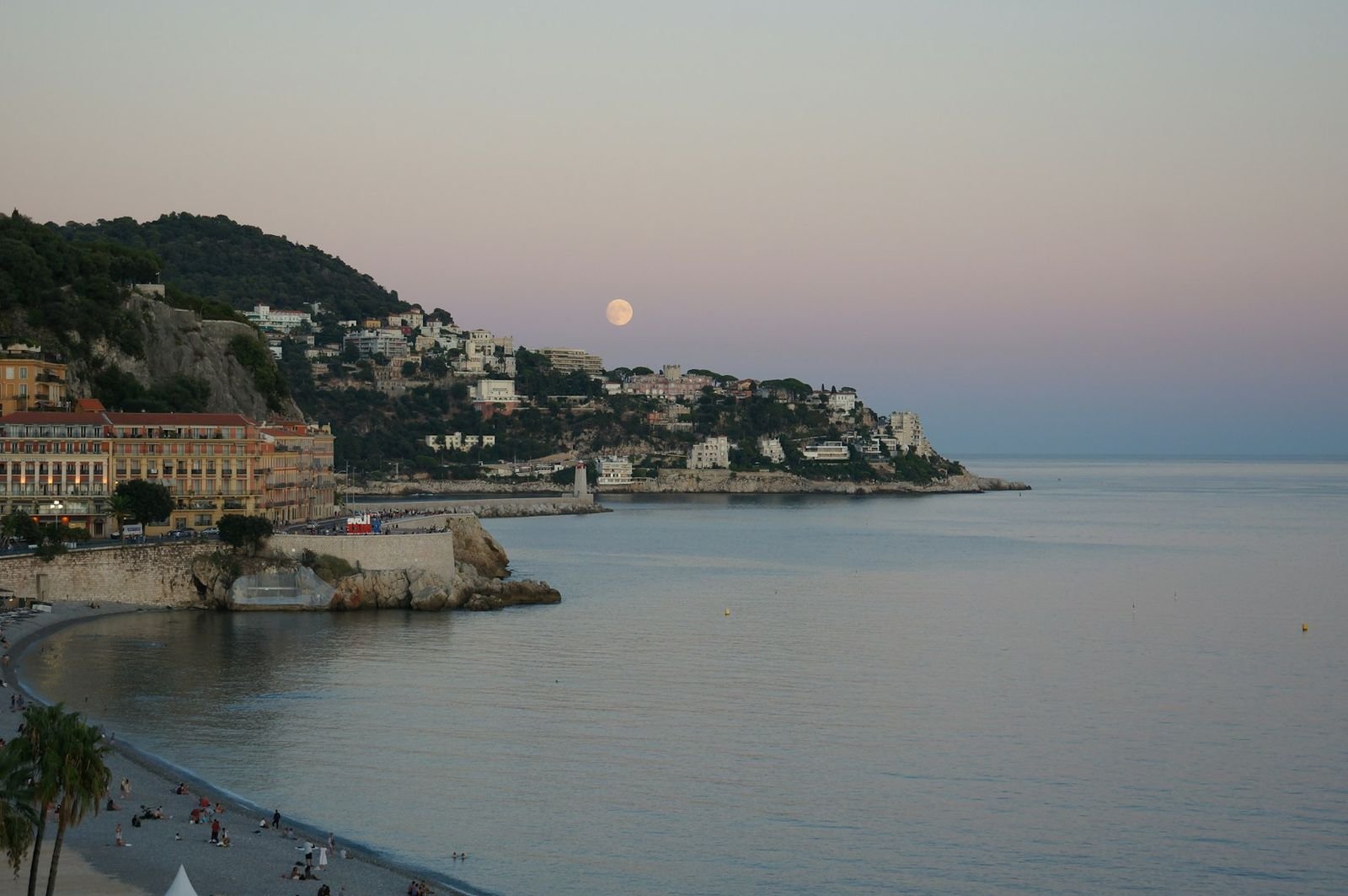 Nice seafront and the bay at dusk, a typical drop-off area for a private airport transfer